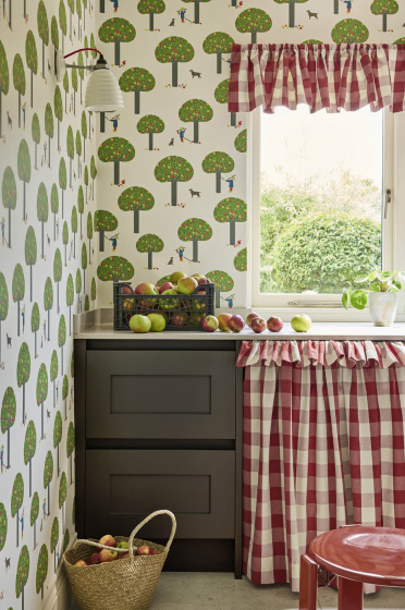 Pantry featuring tree print wallpaper (Rodney Street - Sage & Onions) with dark brown drawers and red gingham hideaway curtain under a window.