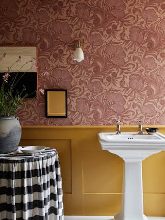 Bathroom with pink floral wallpaper (Poppy Trail - Masquerade) on the upper wall and yellow on the bottom half (Yellow-Pink).