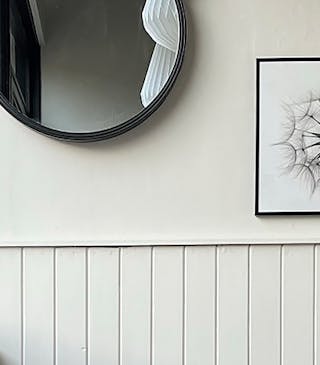 Home entrance with beige walls and paneling (Slaked Lime - Deep), alongside a contrasting black window frame in Jack Black.