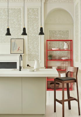 Kitchen counter with neutral green floral wallpaper (Briar Rose - Grene Stone) and neutral green paint on the walls.