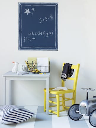 Nursery with Bone China Blue - Pale wall and desk, Hick's Blue chalkboard wall square and a bright yellow (Trumpet) chair.