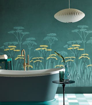 Close-up of dark green floral mural wallpaper (Achillea - Aurora) featuring yellow accents.