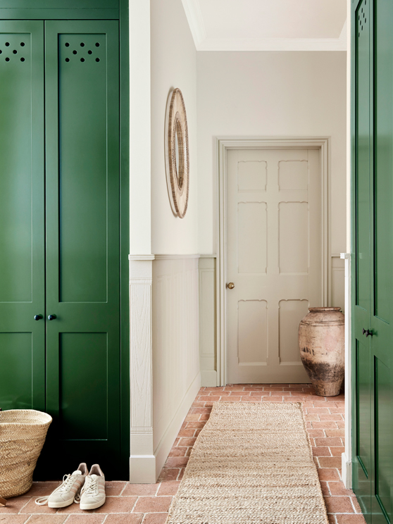 Hallway with various Portland Stone shades on the walls and ceiling, alongside a dark green (Dark Brunswick Green) cupboard.