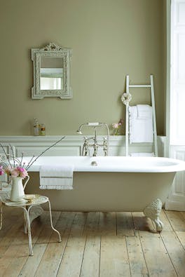 Bathroom with walls, bathtub and panelling painted in various shades of Rolling Fog, a collection of neutral brown paints.