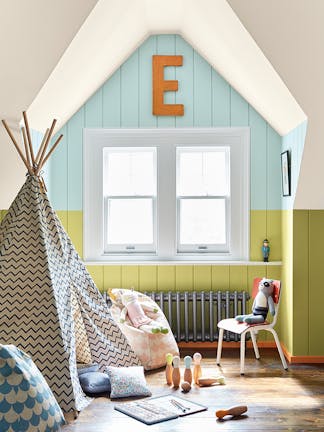 Nursery featuring a Pale Lime green and pale blue-green (Brighton) paneled wall, and bright orange baseboards (Marigold).