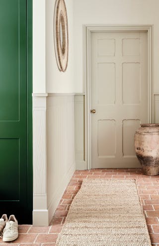 Hallway with various Portland Stone shades on the walls and ceiling, alongside a dark green (Dark Brunswick Green) cupboard.