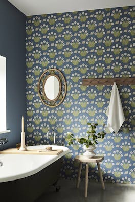 Bathroom with snail-printed wallpaper (Burges Snail - Juniper) on back wall and deep blue (Juniper Ash) on left wall.