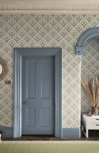 Hallway with blue and pink floral wallpaper (Hencroft - Blue Primula) and matching door and woodwork painted in blue grey.