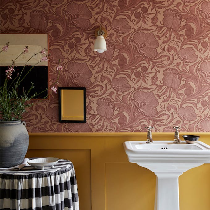 Bathroom with pink floral wallpaper (Poppy Trail - Masquerade) on the upper wall and yellow on the bottom half (Yellow-Pink).