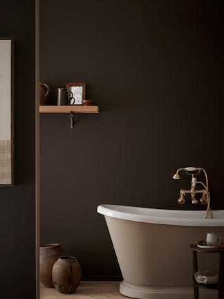 Bathroom colour drenched in deep brown shade 'Chocolate Colour' with a contrasting neutral (Rolling Fog - Dark) bath tub with gold taps.