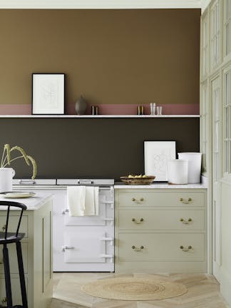 Kitchen scheme with neutral cabinets, dark brown (Elysian Ground) and warm brown (Light Bronze Green) walls with pink stripe.