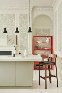 Kitchen counter with neutral green floral wallpaper (Briar Rose - Grene Stone) and neutral green paint on the walls.