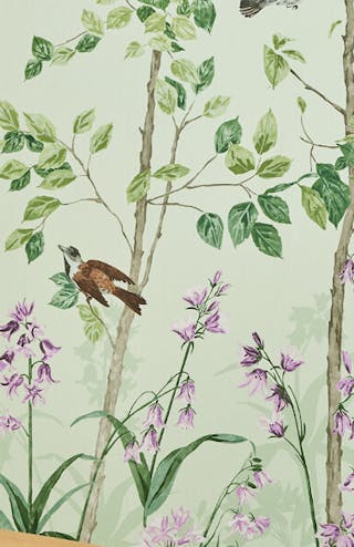 Close-up of green nature-themed mural wallpaper with leaves, bees and lilac flowers (Bird & Bluebell - Pea Green).