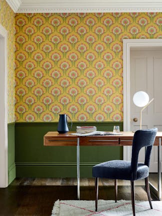 Home study space with the lower wall painted in deep green and yellow floral wallpaper (Hencroft - Punch) on the upper wall.