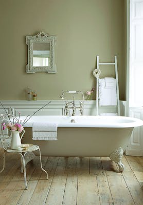 Bathroom with walls, bathtub and panelling painted in various shades of Rolling Fog, a collection of neutral brown paints.