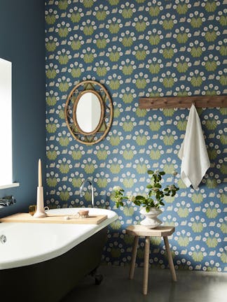 Bathroom with snail-printed wallpaper (Burges Snail - Juniper) on back wall and deep blue (Juniper Ash) on left wall.