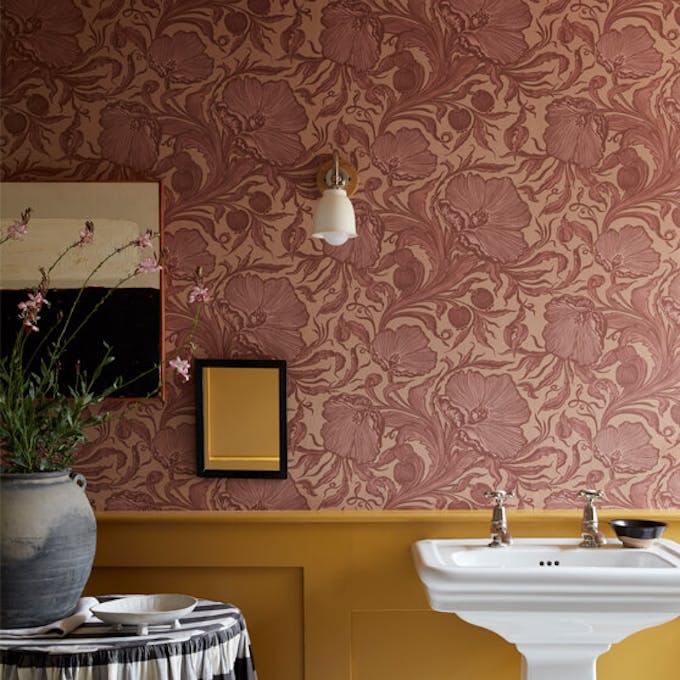 Bathroom with pink floral wallpaper (Poppy Trail - Masquerade) on the upper wall and yellow on the bottom half (Yellow-Pink).