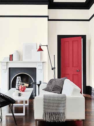 Living room painted in pale grey (French Grey - Pale) with 'Jack Black' trim and a bright red door painted in 'Atomic Red'.