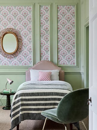 Bedroom with a pink and green flower pattern wallpaper (Hencroft - Pink Primula), and light green (Pea Green) panelling.