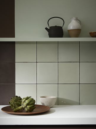 Kitchen featuring Aquamarine walls and tiles, as well as cupboards painted in dark purple (Purple Bown).