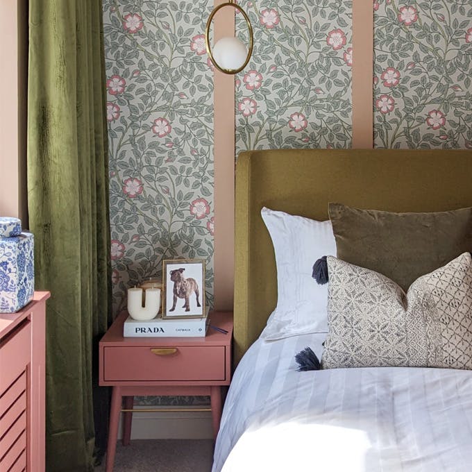 Briar Rose - Salix wallpaper featured within pink panelling alongside pink walls, ceiling, radiator cover and side table.