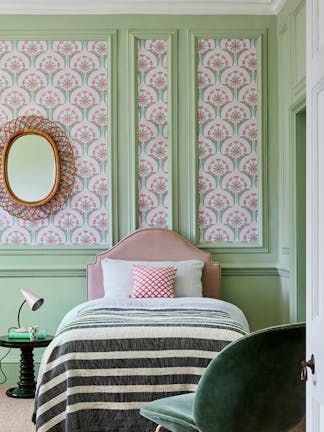 Bedroom with a pink and green flower pattern wallpaper (Hencroft - Pink Primula), and light green (Pea Green) panelling.