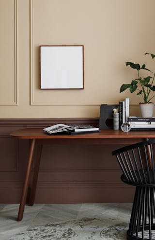 Warm neutral (Castell Pink) home study area with a red (Arras) door next to a wooden desk and chair. 