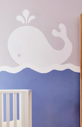 Nursery wall using Welcome, Welcome – Pale and Pale Lupin, featuring a large painting of a whale.