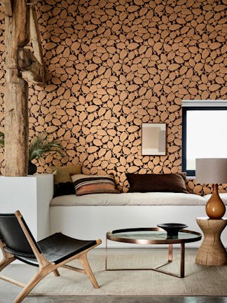 Country-style home with orange and burgundy leaf-printed wallpaper (Beech Nut – Córdoba) and thick wooden ceiling beams.