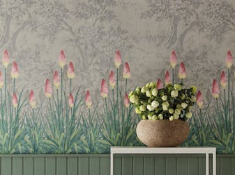 Grey forest wallpaper with pink torch lilies at the forefront (Upper Brook Street - Matin) behind a side table and flowers.