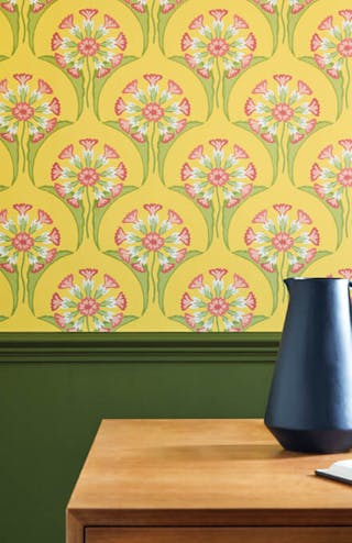 Office with two-tone wall decor, featuring Hencroft - Punch floral wallpaper above and deep green (Jewel Beetle) paint below.