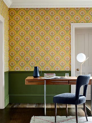 Office with two-tone wall decor, featuring Hencroft - Punch floral wallpaper above and deep green (Jewel Beetle) paint below.