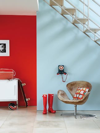 Hallway with a pale blue-green (Brighton) wall in the foreground and a bright red (Atomic Red) wall in the background.