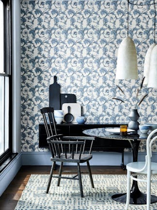 Dining room with a blue and off-white Georgian style wallpaper (Stag Trail - Sky) with a table and chairs.